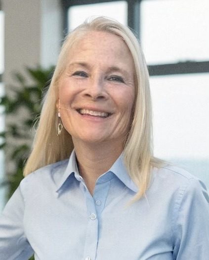 Woman in office setting smiling